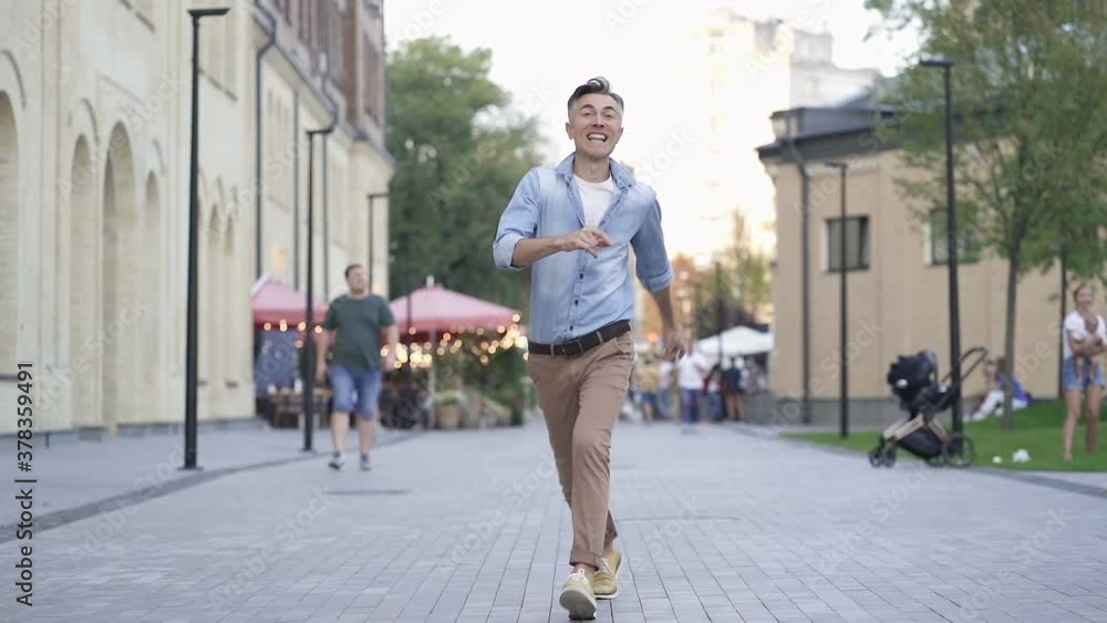 Excited and happy man victory jumping at the street. Slowmotion. Excited and happy man victory jumping at the street. Slowmotion.