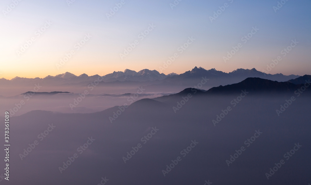 Dawn in Himalayas. Pinkish morning view to Himalayan range from the top of Pikey peak. Nepal.