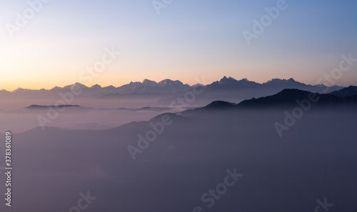 Dawn in Himalayas. Pinkish morning view to Himalayan range from the top of Pikey peak. Nepal.