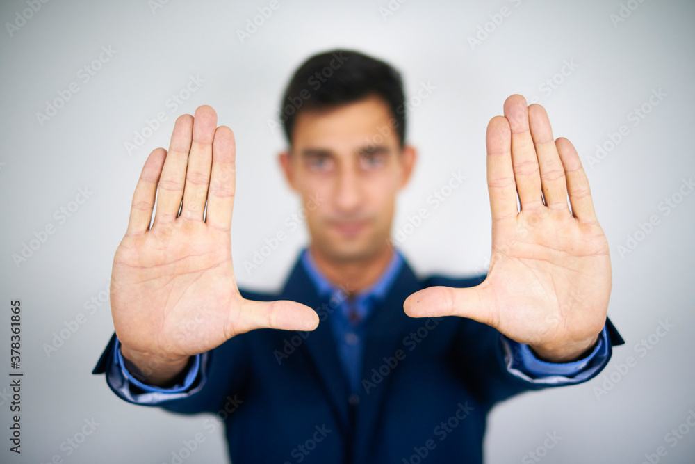 A businessman holding his palms in the air. Concept of framing, problem framing. A businessman holding his palms in the air. Concept of framing, problem framing.