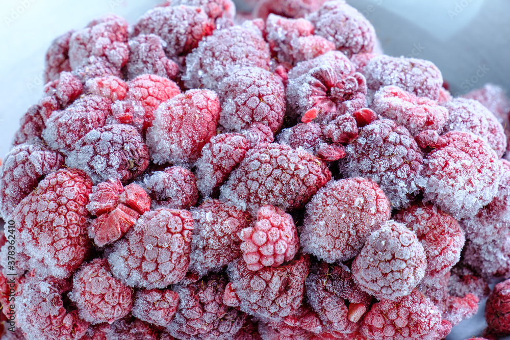 Ein Haufen gefrorene Himbeeren / Tiefkühlkost Ein Haufen gefrorene Himbeeren / Tiefkühlkost