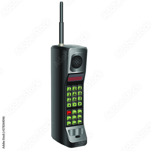 A big, old, black cell phone with an antenna, green buttons,and red numbers. One of the first wireless phones