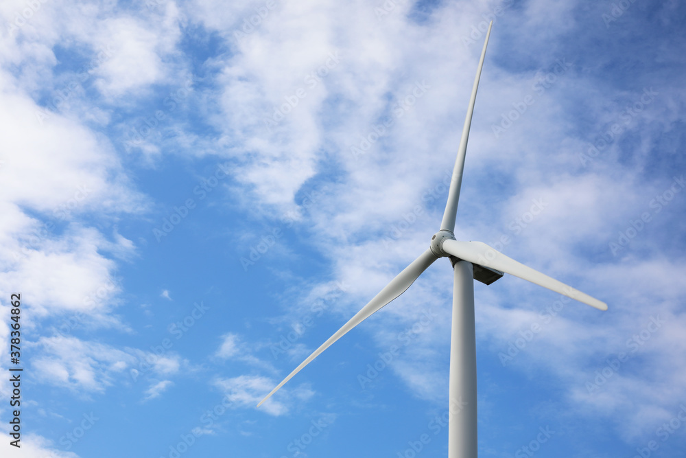 Wind turbine against beautiful blue sky. Alternative energy source Wind turbine against beautiful blue sky. Alternative energy source