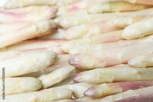 Fresh ripe white asparagus as background, closeup