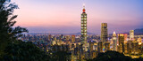 View from above, stunning aerial view of the Taipei City skyline illuminated during a beautiful sunset. Panoramic view from the Mount Elephant in Taipei, Taiwan.