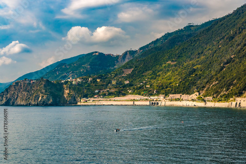 Panoramic view of the coastal area of Corniglia seen from Manarola. On the left side on top of the promontory is Corniglia and on the right side below the vineyards and terraces the train station. © H-AB Photography