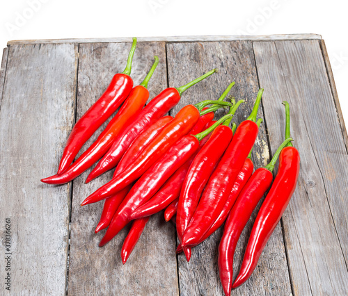 Fresh peppers on wooden floors isolated on white background