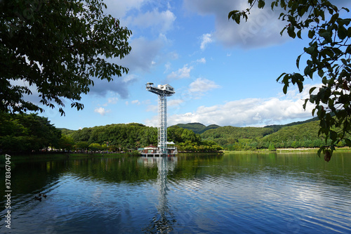 Bungee jump at the lakeside with blue sky