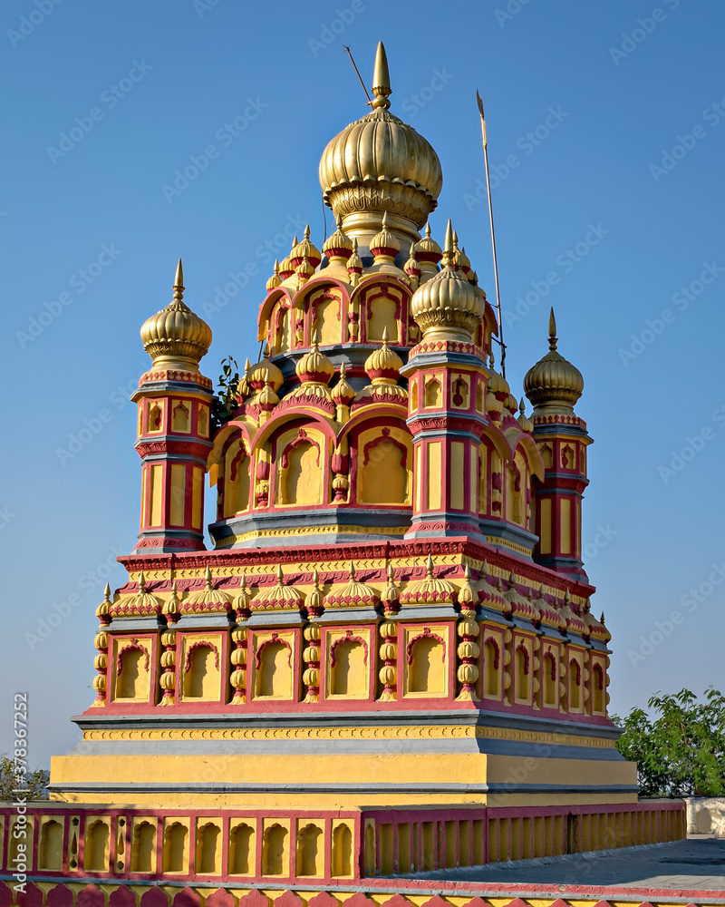 Dome of oldest heritage structure in Pune-Parvati temple with blue sky background.