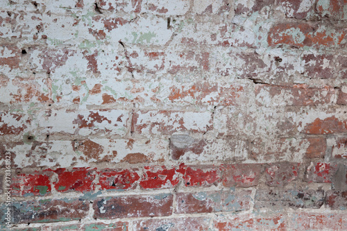 Old Brick wall with peeling paint