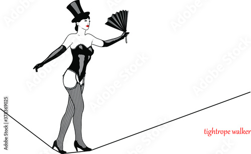 sexy retro girl dressed in a variety show fashion of the beginning of the last century walks the tightrope keeping balance