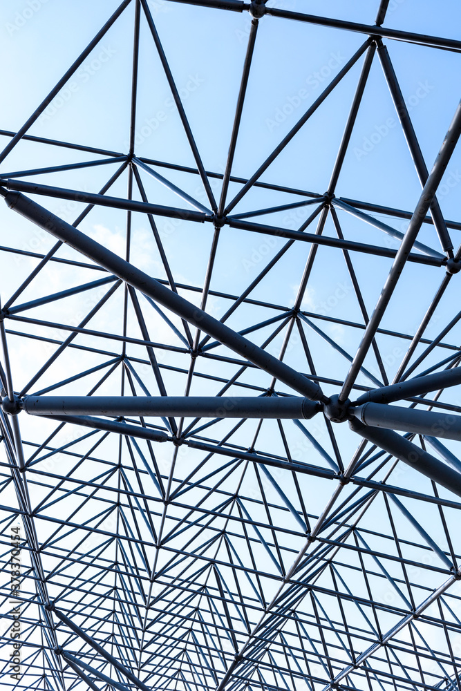 metal frame beams of modern building on sky background metal frame beams of modern building on sky background