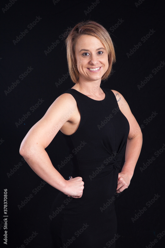 Pretty Blond with a smile and her hands on her hips Pretty Blond with a smile and her hands on her hips