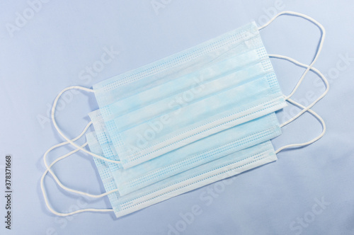 Background concept for news about the novel coronavirus COVID-19 pandemic, antiviral medical mask for protection against coronavirus. Surgical protective mask.