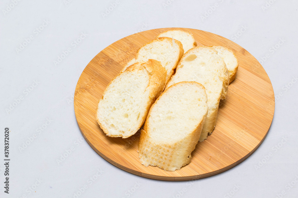 bread and slice of bread,wooden background for design bread and slice of bread,wooden background for design