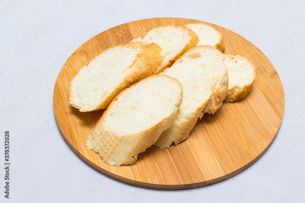 bread and slice of bread,wooden background for design bread and slice of bread,wooden background for design