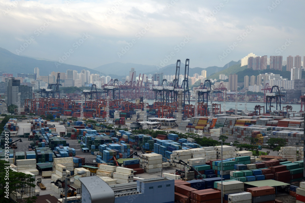 Fototapeta premium Large heavy containers in harbor of Hong Kong