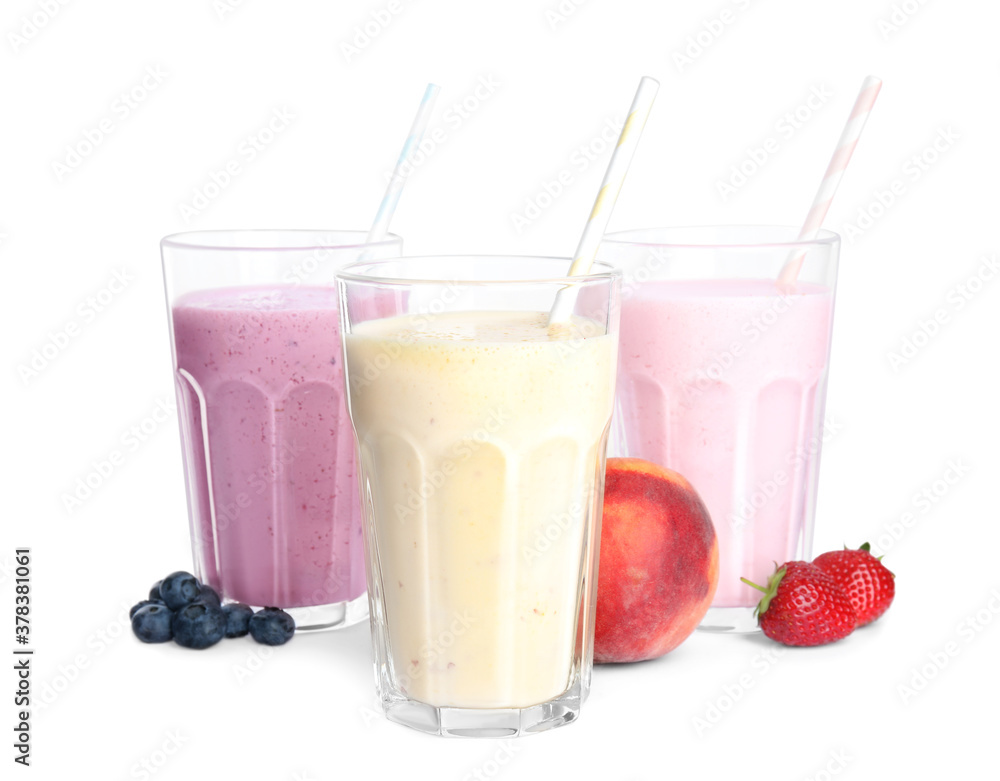 Different tasty milk shakes and fruits isolated on white Different tasty milk shakes and fruits isolated on white