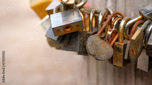 Lovers / Valentine's Day background - Many rusty weathered different Love padlocks / curtain lock