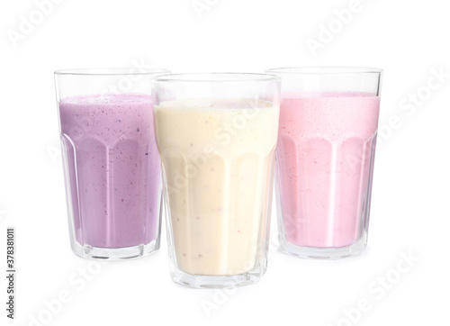 Different tasty milk shakes isolated on white