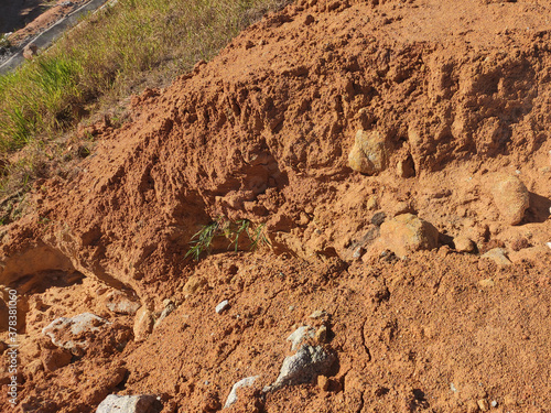 Erosion at ground and slopes is caused by rainfall. The soil structure is weak and there are landslide. Safety measure has been taken in some area.