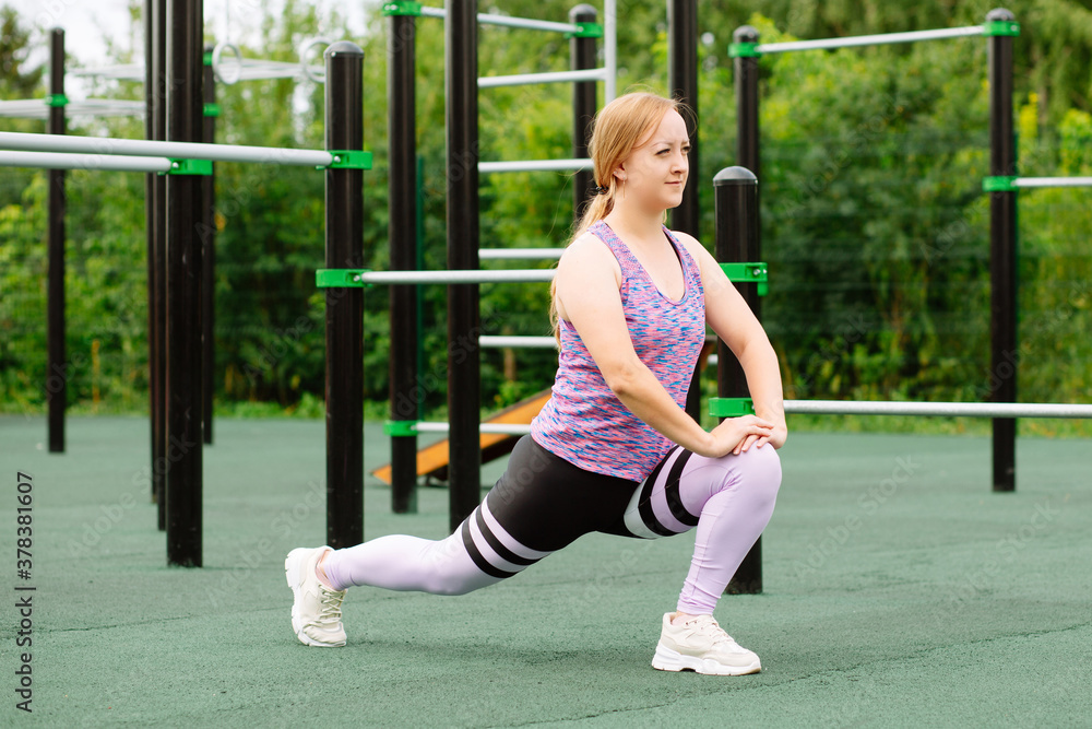 Fototapeta premium fitness and lifestyle concept - woman doing sports outdoors