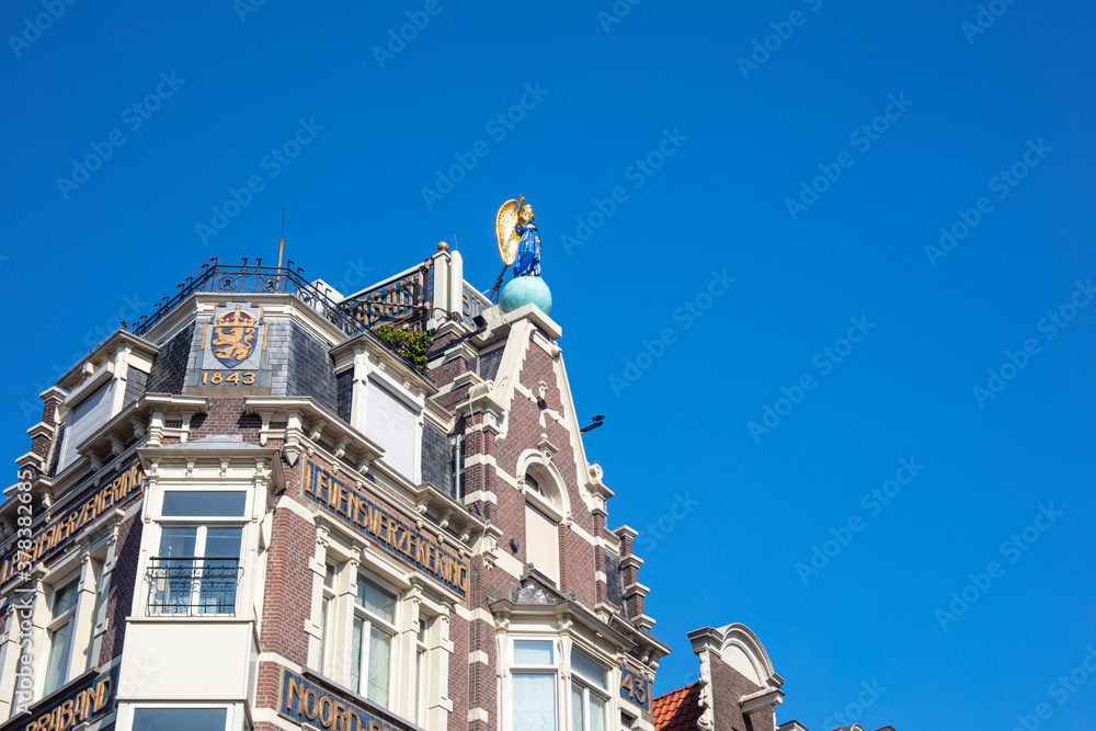 Detail of building with copy space in blue sky background in Amsterdam, Netherlands