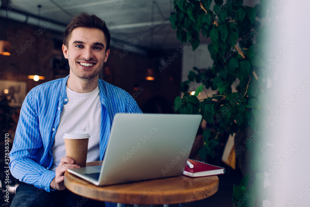 Happy businessman with laptop and coffee Happy businessman with laptop and coffee