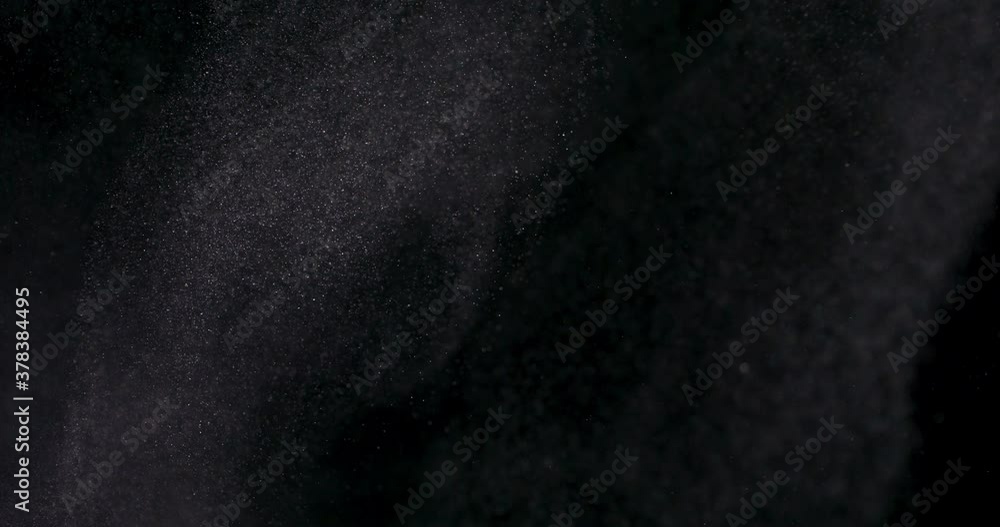 White dust powder isolated on black background White dust powder isolated on black background