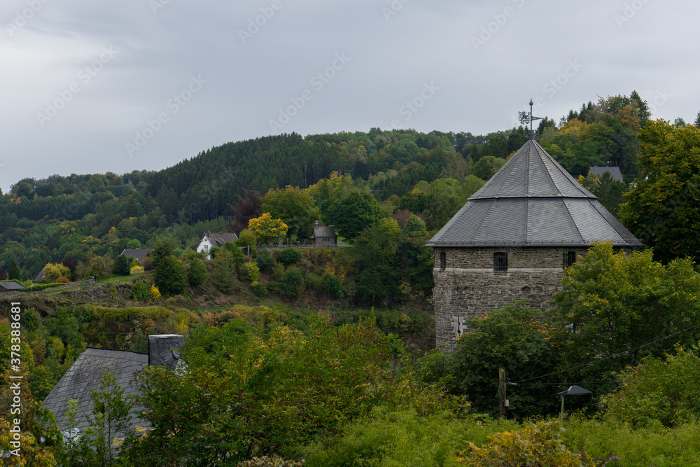 View to round tower of the castle in the german village called Monschau View to round tower of the castle in the german village called Monschau