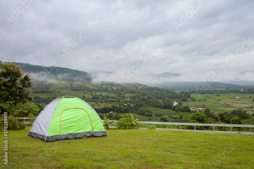 camping tents on green grass fileld