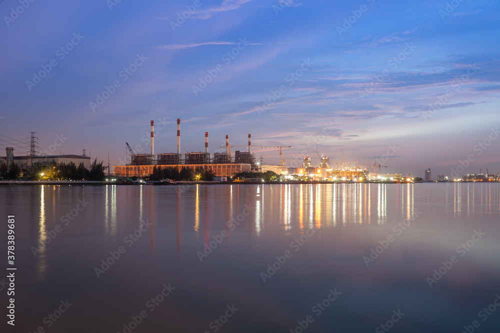 power plant reflection on river againts sky power plant reflection on river againts sky