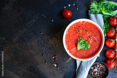 Obraz na plátně tomato soup gazpacho in a plate on the table tasty serving size portion top view