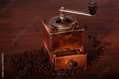 Old coffee grinder on the table.