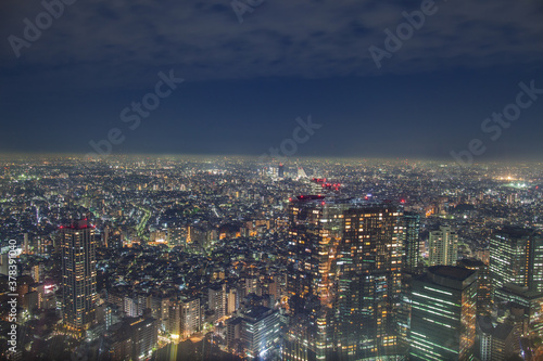 Fototapeta Naklejka Na Ścianę i Meble -  Night cityscape view againts sky