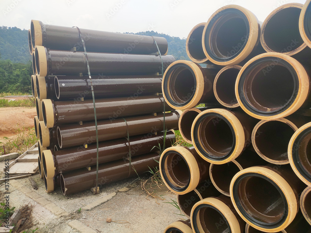 SEREMBAN, MALAYSIA -MARCH 2, 2020: Vitrified clay pipe stacked at the construction site. Commonly used as the sewerage underground pipe. It is lasting and heavy-duty. SEREMBAN, MALAYSIA -MARCH 2, 2020: Vitrified clay pipe stacked at the construction site. Commonly used as the sewerage underground pipe. It is lasting and heavy-duty.