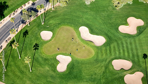 Golf green with sand traps photo