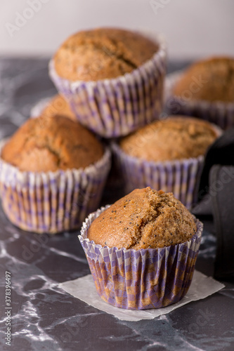 Sweet cakes or cupcakes on light marble background. Holiday cake celebration, delicious dessert, close up