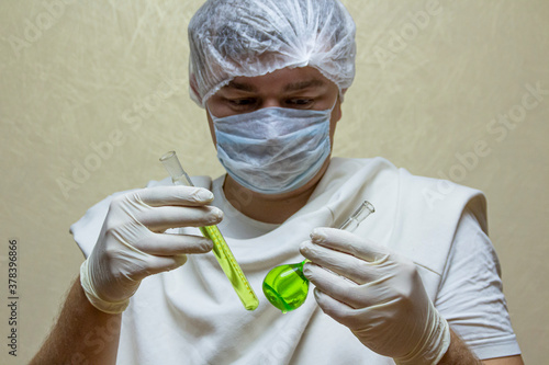 scientist in laboratory with test tubes
