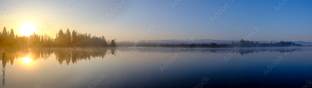 Panorama of Kirchsee lake at foggy sunrise Panorama of Kirchsee lake at foggy sunrise
