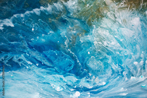 Abstraction. Ocean. Sea. Fluid art. Natural luxury. The style includes swirls of marble or ripples of agate. Very beautiful blue paint with the addition of gold powder