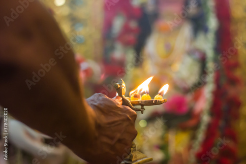 worship of indian god godess idol arati with pancha pradip photo