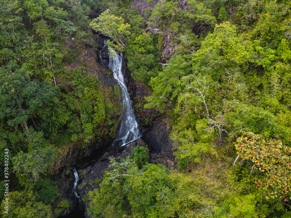 Myanmar, Mergui or Myeik Archipelago, Dome island, Waterfall in tropical forest, aerial view Myanmar, Mergui or Myeik Archipelago, Dome island, Waterfall in tropical forest, aerial view