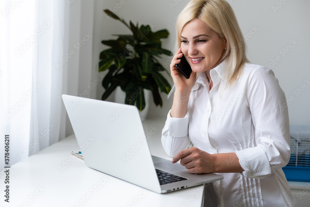 Beautiful young woman having video conference call via computer. Call Meeting. Home office. Stay at home and work from home concept during Coronavirus pandemic Beautiful young woman having video conference call via computer. Call Meeting. Home office. Stay at home and work from home concept during Coronavirus pandemic
