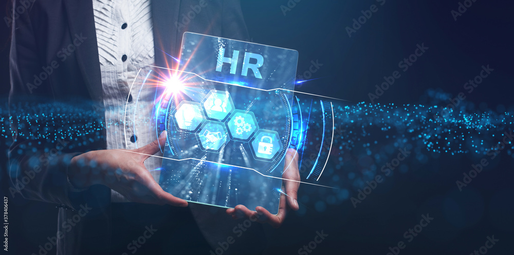 Business, Technology, Internet and network concept. Young businessman working on a virtual screen of the future and sees the inscription: HR Business, Technology, Internet and network concept. Young businessman working on a virtual screen of the future and sees the inscription: HR