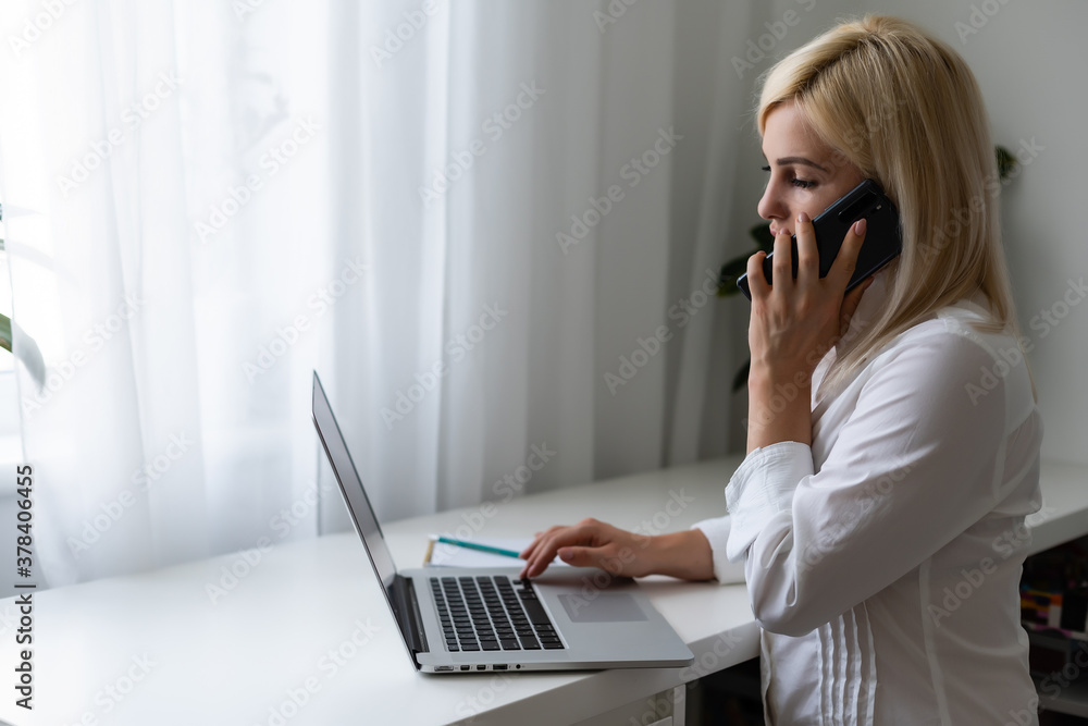 Beautiful young woman having video conference call via computer. Call Meeting. Home office. Stay at home and work from home concept during Coronavirus pandemic Beautiful young woman having video conference call via computer. Call Meeting. Home office. Stay at home and work from home concept during Coronavirus pandemic