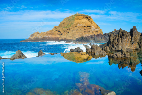 Ocean bathes lava pools Mad...