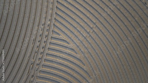 cementitious adhesive applied to the floor ready to receive the ceramic tile