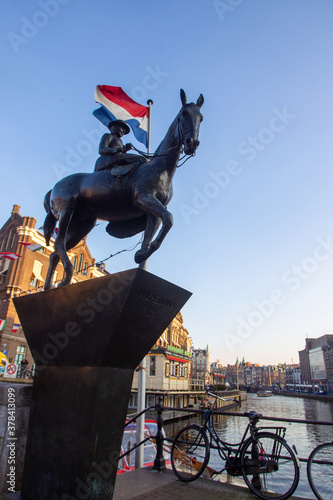 Monument to Queen Wilhelmina  on horse  in Amsterdam at sunset in winter