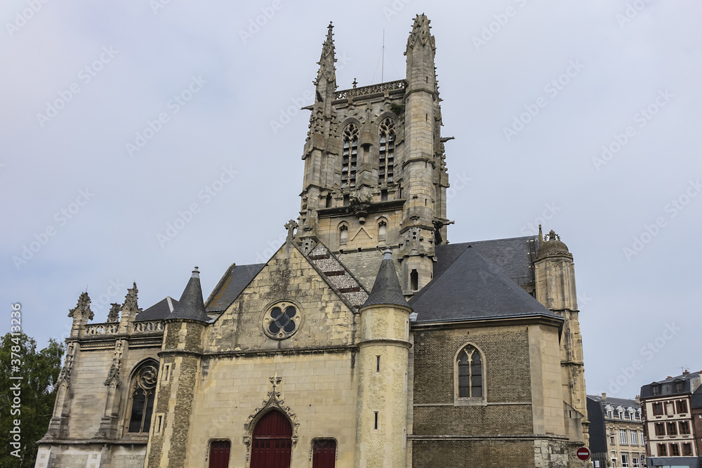 Built in heart of Fecamp XVI century Saint-Etienne church dominates now wearing Norman city: Renaissance portal, flamboyant Gothic steeple. Fecamp, Seine-Maritime department, Haute-Normandie, France. Built in heart of Fecamp XVI century Saint-Etienne church dominates now wearing Norman city: Renaissance portal, flamboyant Gothic steeple. Fecamp, Seine-Maritime department, Haute-Normandie, France.